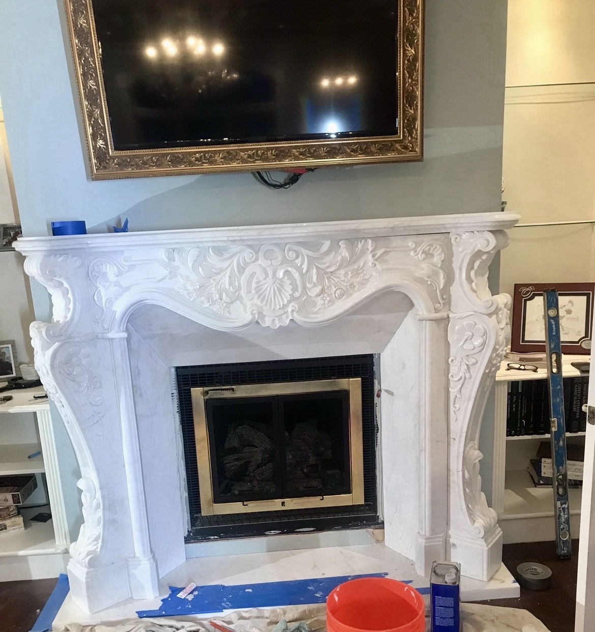 Hand-carved white marble fireplace mantel with shell and foliate relief