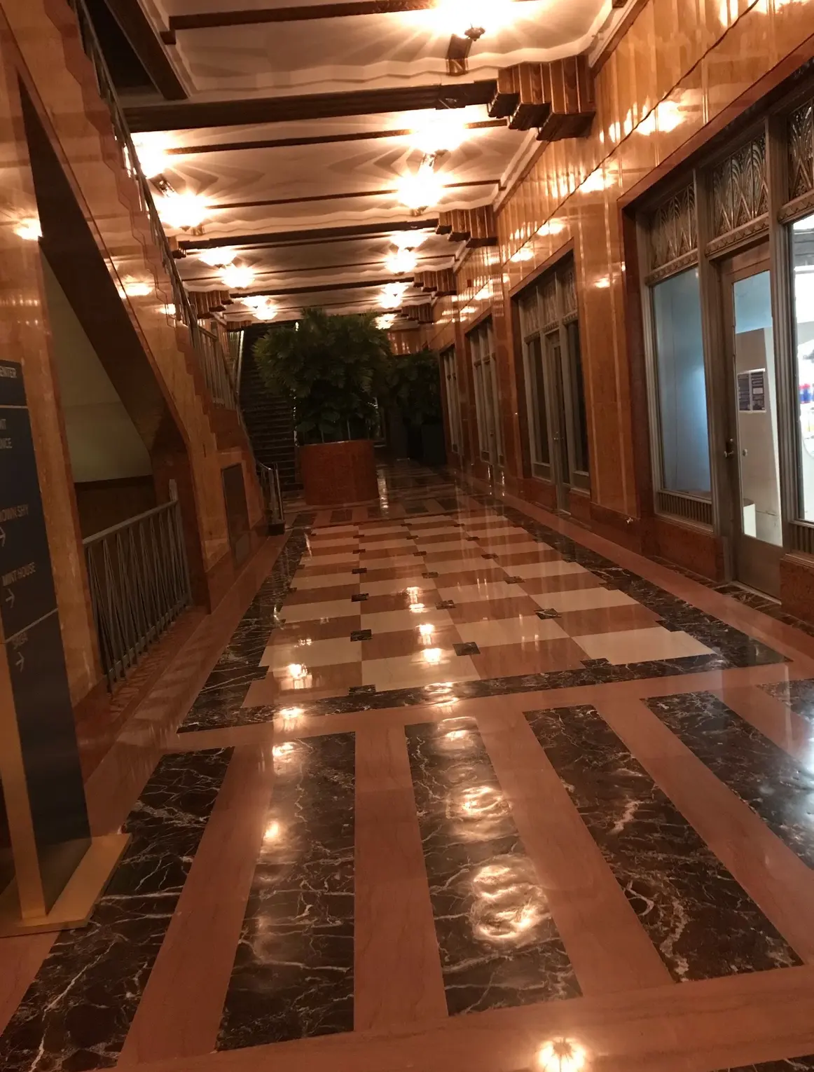 Grand commercial lobby with polished marble floor and granite inlay borders